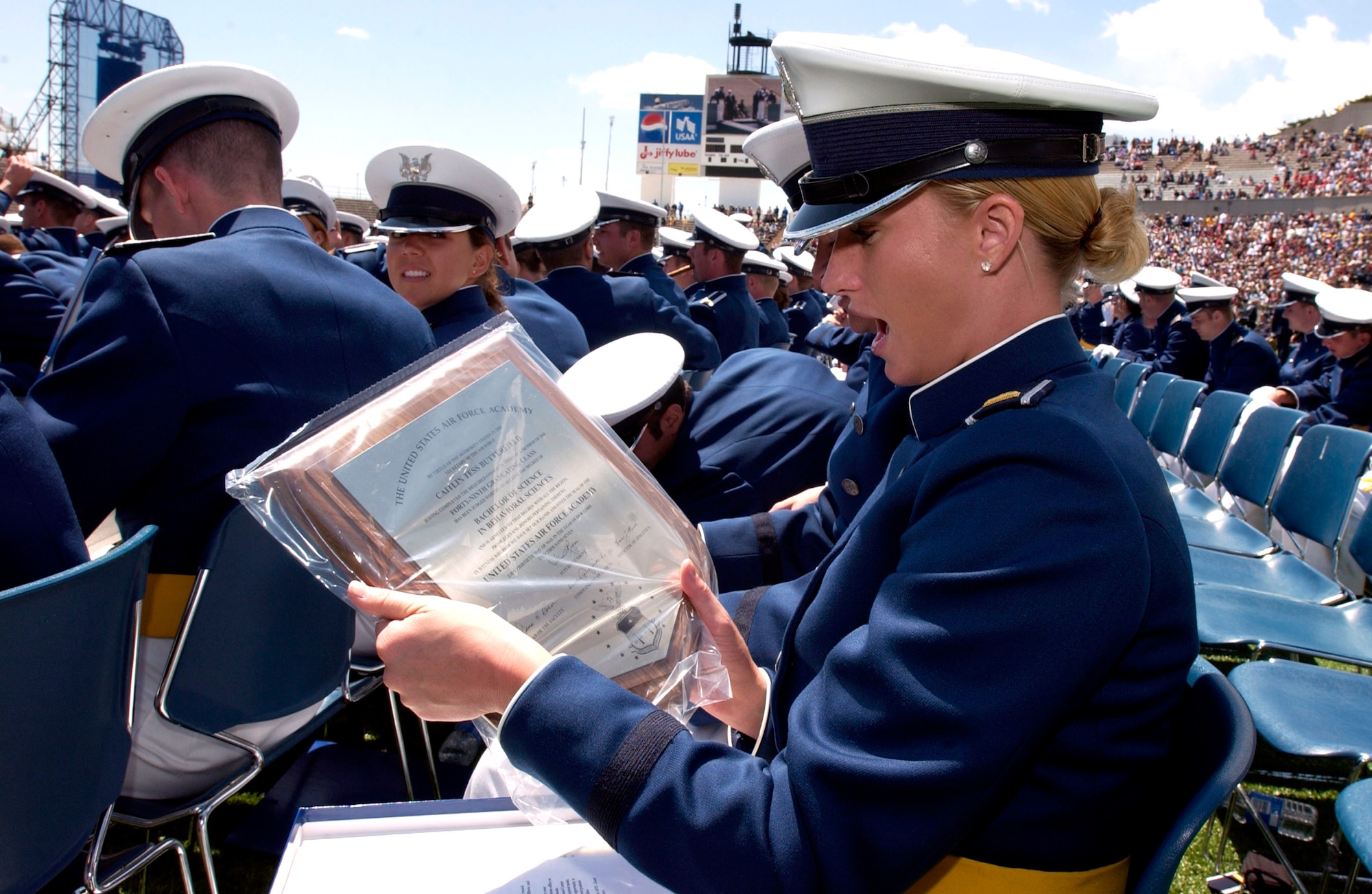 Newly minted 2nd Lt. Catlin Tess Butterfield admires her diploma during the 2007 U.S. Air Force Academy graduation ceremony May 30 in Colorado Springs, Colo. (U.S. Air Force photo/Mike Kaplan)