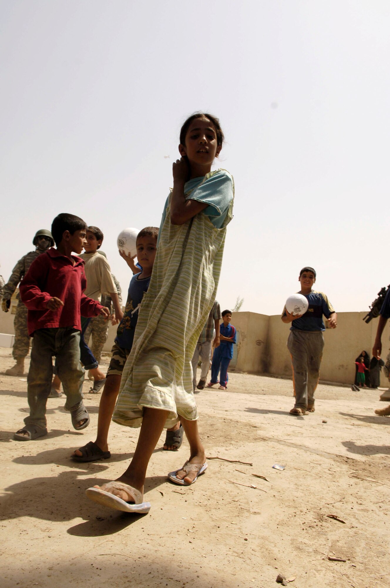 During a recent humanitarian mission May 24, U.S. servicemembers worked with the Iraqi National Police to distribute school supplies, toys and treats to children in Al Furat, Iraq. (U.S. Air Force photo/Master Sgt. Brian L. Boone)