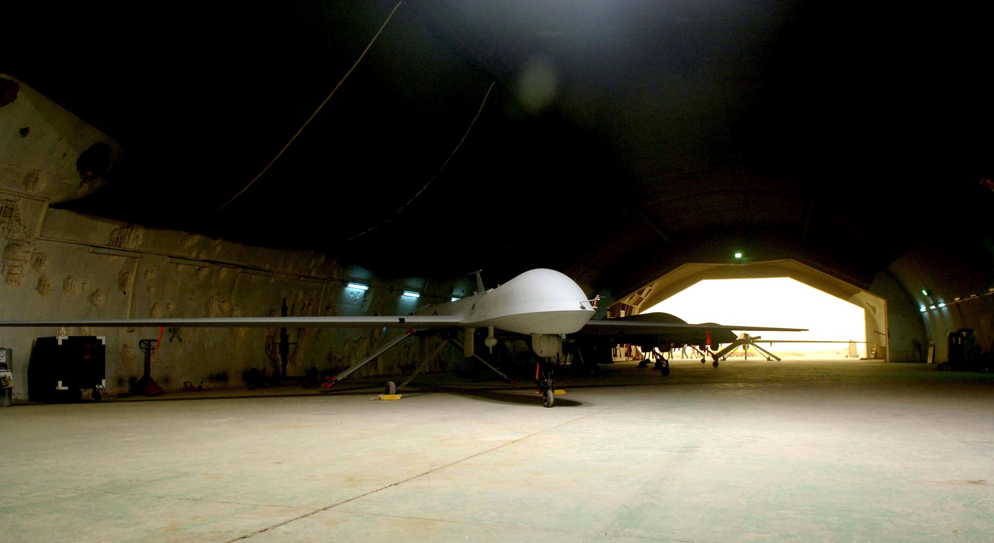 An MQ-1 Predator unmanned aerial vehicle sits in its hangar at Balad Air Base, Iraq, May 17 awaiting its next mission.  The Predator provides armed reconnaissance, airborne surveillance and target acquisition for Operation Iraqi Freedom and Operation Enduring Freedom.  (U.S. Air Force photo/Airman 1st Class Jonathan Steffen)