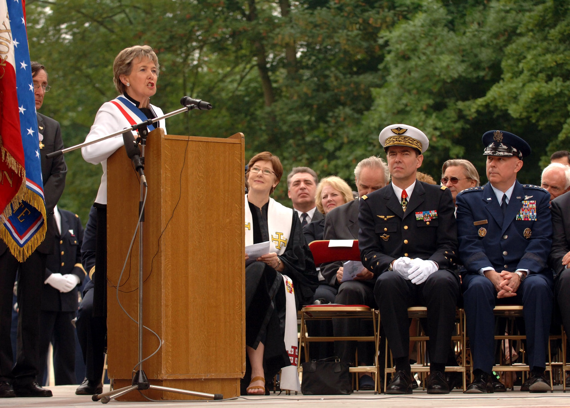 Air Force Chief of Staff Gen. T. Michael Moseley and his French counterpart, Gen. Stephane Abrial, listen as Christiane Barody-Weiss, mayor of Marnes-la-Coquette, a community outside of Paris, pays tribute to the American aviators who comprised the Lafayette Escadrille, an all-American squadron of volunteers who flew under the French flag during World War I.  During this ceremony at the Lafayette Memorial, French and Americans gathered to honor the aviators, many of whom gave their lives in defense of French democracy. (U.S. Air Force photo/Master Sgt. Scott Wagers)