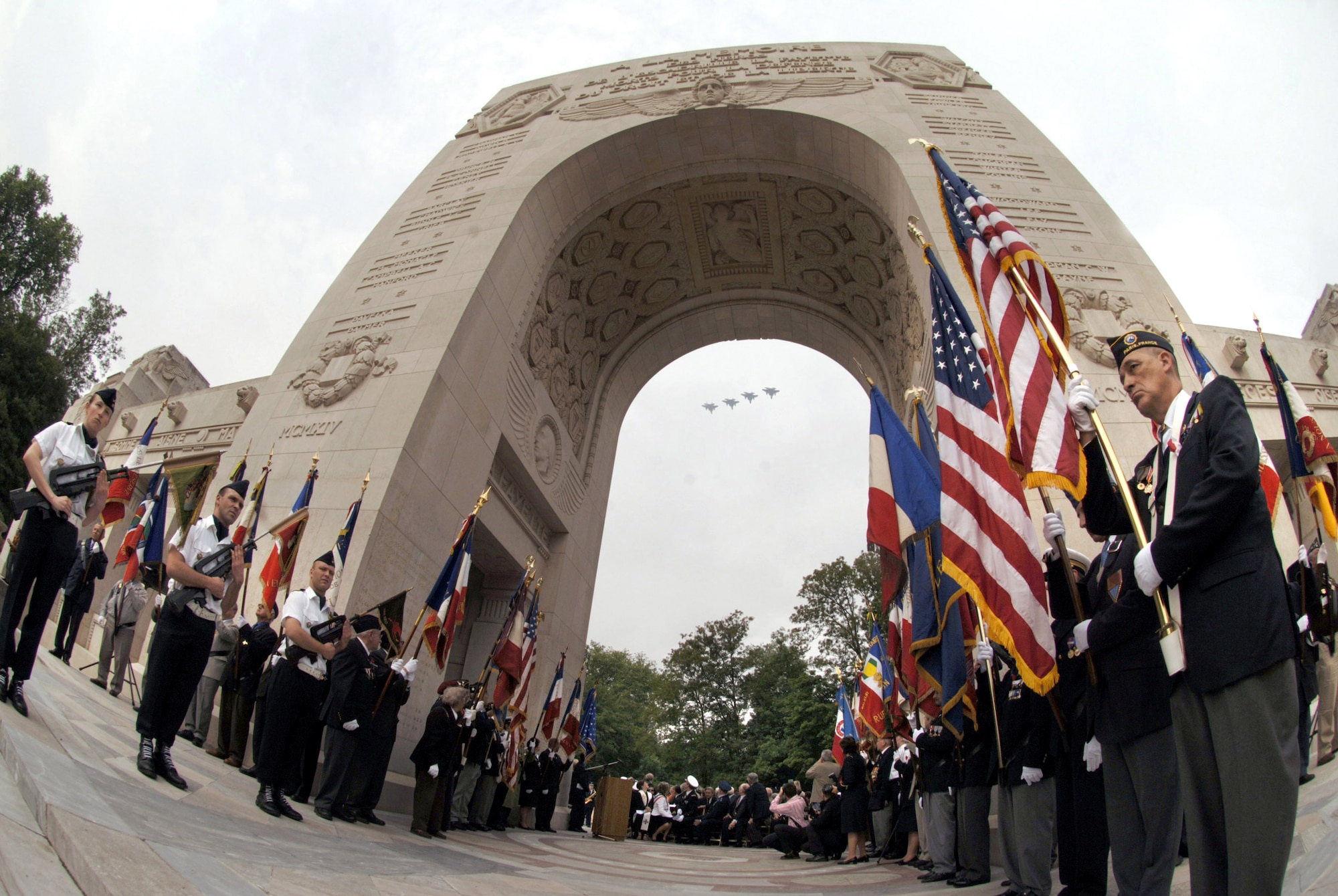 Military fighters fly over a ceremony at the Lafayette Memorial  outside Paris where French and Americans gathered to pay homage to the United States' first combat aviators who comprised the Lafayette Escadrille.  The all-American squadron of volunteers flew under the French flag during World War I where many gave their lives.  The F-15 Eagles that were part of the flyover are from the 48th Fighter Wing at Royal Air Force Lakenheath, England.  (U.S. Air Force photo/Master Sgt. Scott Wagers)