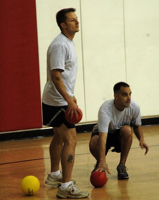 Tech. Sgt. Doyle Stricker (left) and Tech. Sgt. Peter Mongillo (right), both from the 381st Training Group, participate in a series of dodgeball games against youths from the Vandenberg youth center. The "Fantastic Five", a team of five youths from the Vandenberg youth center, competed against the "381st Titans", a team of five Airman from Vandenberg, in a dodgeball competition at the Vandenberg youth center on May 25. The Fantastic Five annihilated the 381st Titans in two out of three games.