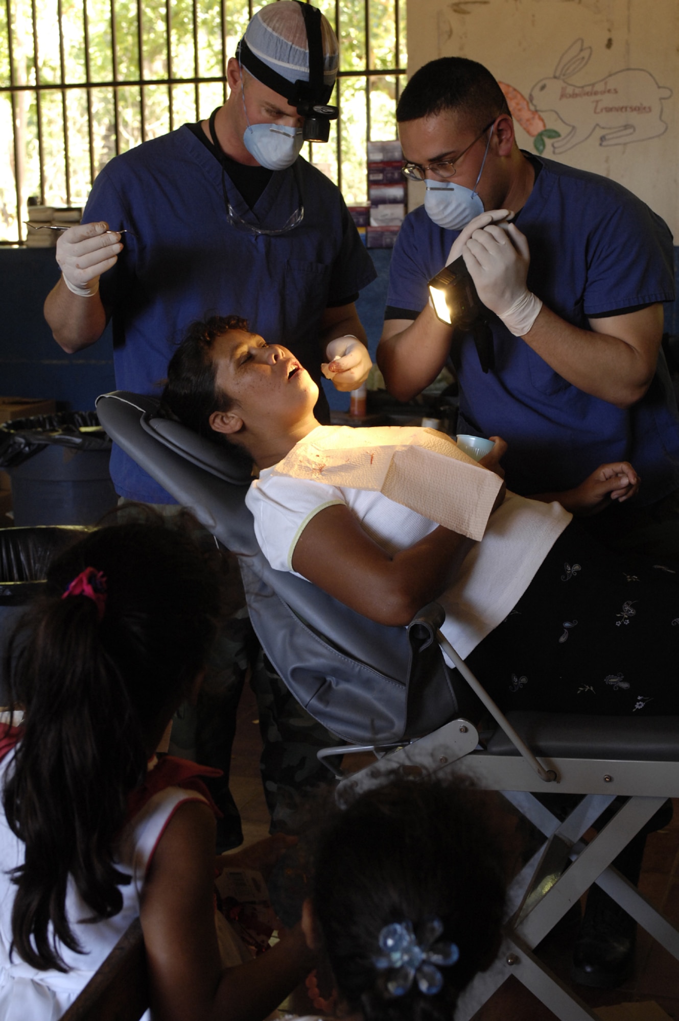 Captain (Dr.) Nick DuVall, 7th Aeromedical/Dental Squadron dentist, and Staff Sgt. Christian Guillen, 7th ADOS dental technician, provide dental services to Nicaraguan natives while on a humanitarian mission February and March. They were were among 19 other Air Force members from various Air Force bases and specialties who deployed to give free health care to Nicaraguan citizens during Operation New Horizon '07, a medical readiness exercise in Santa Teresa, Nicaragua. (U.S. Air Force photo)
