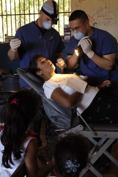 Captain (Dr.) Nick DuVall, 7th Aeromedical/Dental Squadron dentist, and Staff Sgt. Christian Guillen, 7th ADOS dental technician, provide dental services to Nicaraguan natives while on a humanitarian mission February and March. They were were among 19 other Air Force members from various Air Force bases and specialties who deployed to give free health care to Nicaraguan citizens during Operation New Horizon '07, a medical readiness exercise in Santa Teresa, Nicaragua. (U.S. Air Force photo)
