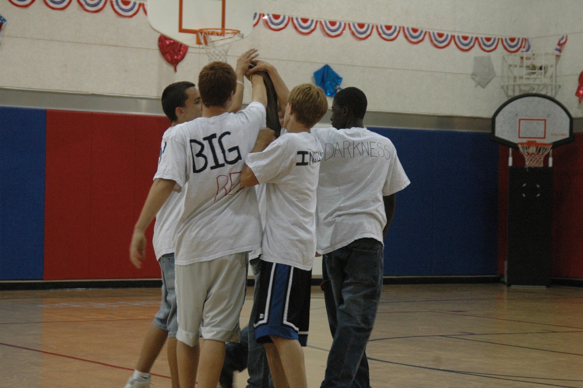 "Big Red" Austin Cambelin, "Indian" Joey Powell, "Polo" Marko Marrero, "Darkness" Trey Rogers and "The Beast" Jason Sullivan, The "Fantastic Five" dodgeball players from the Vandenberg youth center, rally together before a match against the "381st Titans". The Fantastic Five won two out of three matches and cinching the 1st place title. (U.S. Air Force photo by Staff Sgt. Raymond Hoy)