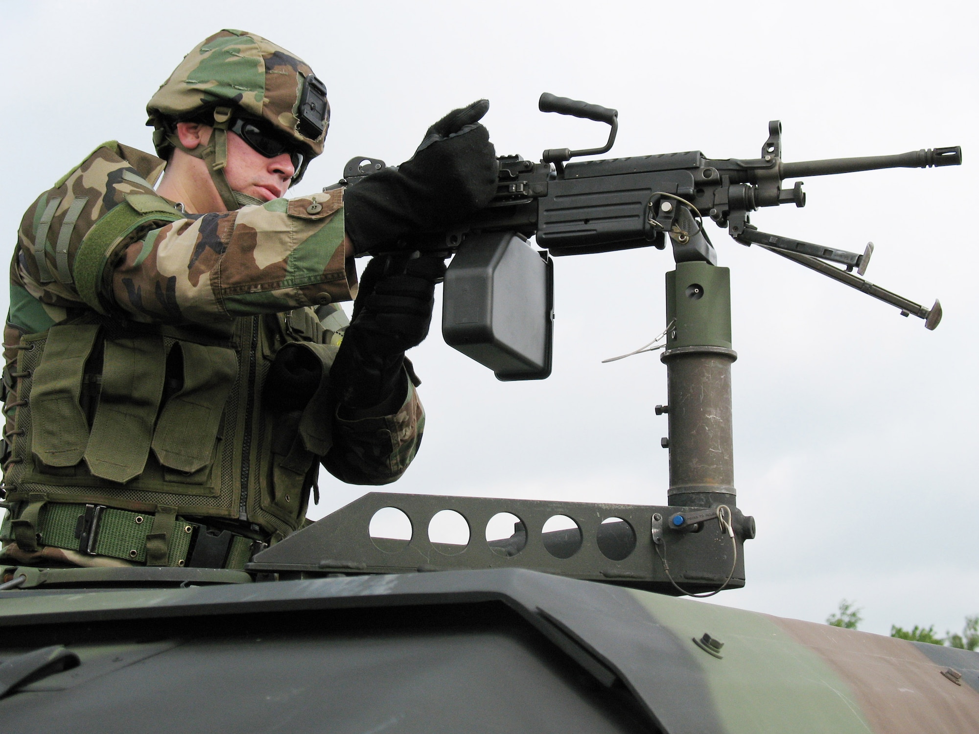A security forces Airman prepares to fire at his next target as part of the live fire simulation at the Creek Defender exercise held May 30 at Baumholder, Germany. Airmen first learn to fire at stationary targets from a moving convoy of Humvees, to prepare them for real-world scenarios. (U.S. Air Force photo/Staff Sgt. Lance Heinzelman)