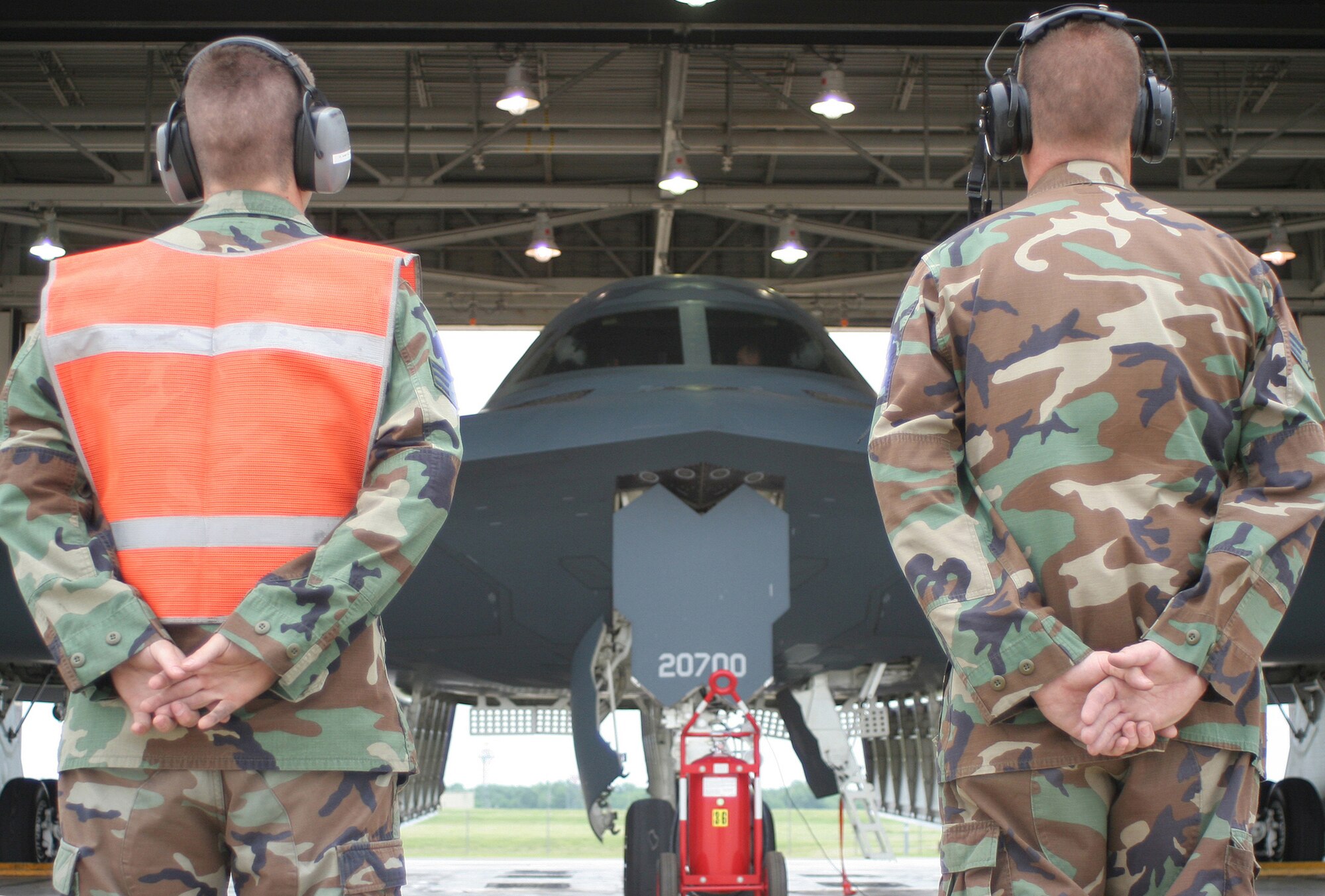 Senior Airmen Eric Hinckley (left) and Christopher Smith, 509th Aircraft Maintenance Squadron, prepare to launch a B-2 for a training sortie May 24. (U.S. Air Force photo/Tech. Sgt. Matt Summers)