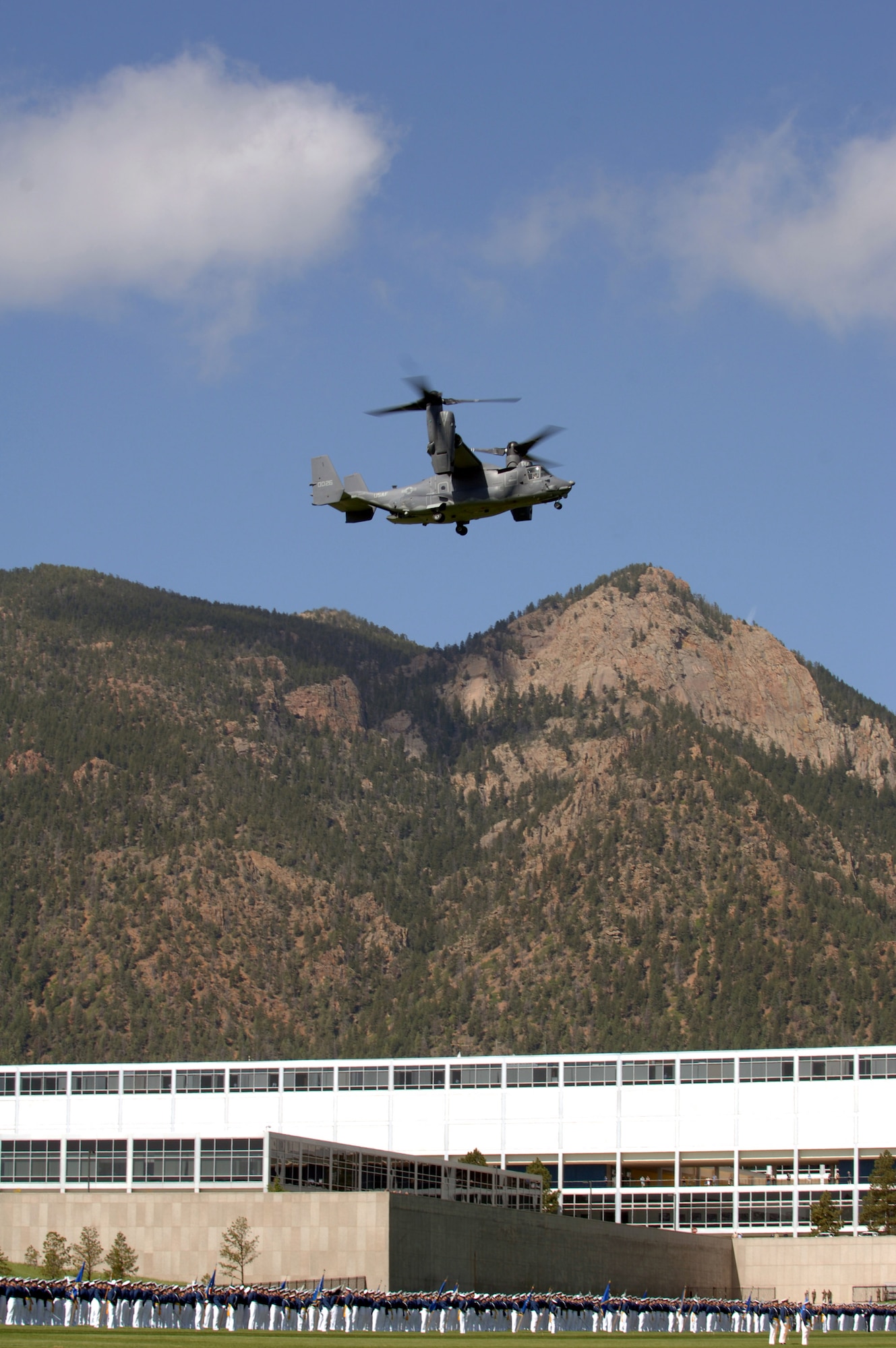 A CV-22 Osprey flies over the 2007 Graduation Parade May 29 at the U.S. Air Force Academy in Colorado. The graduation for the U.S. Air Force Academy's Class of 2007 will be held at 10 a.m. May 30 at Falcon Stadium. Secretary of Defense Dr. Robert M. Gates will be the guest speaker. Each cadet graduates with a bachelor of science degree and a commission as a second lieutenant in the Air Force. (U.S. Air Force photo/David Armer) 
