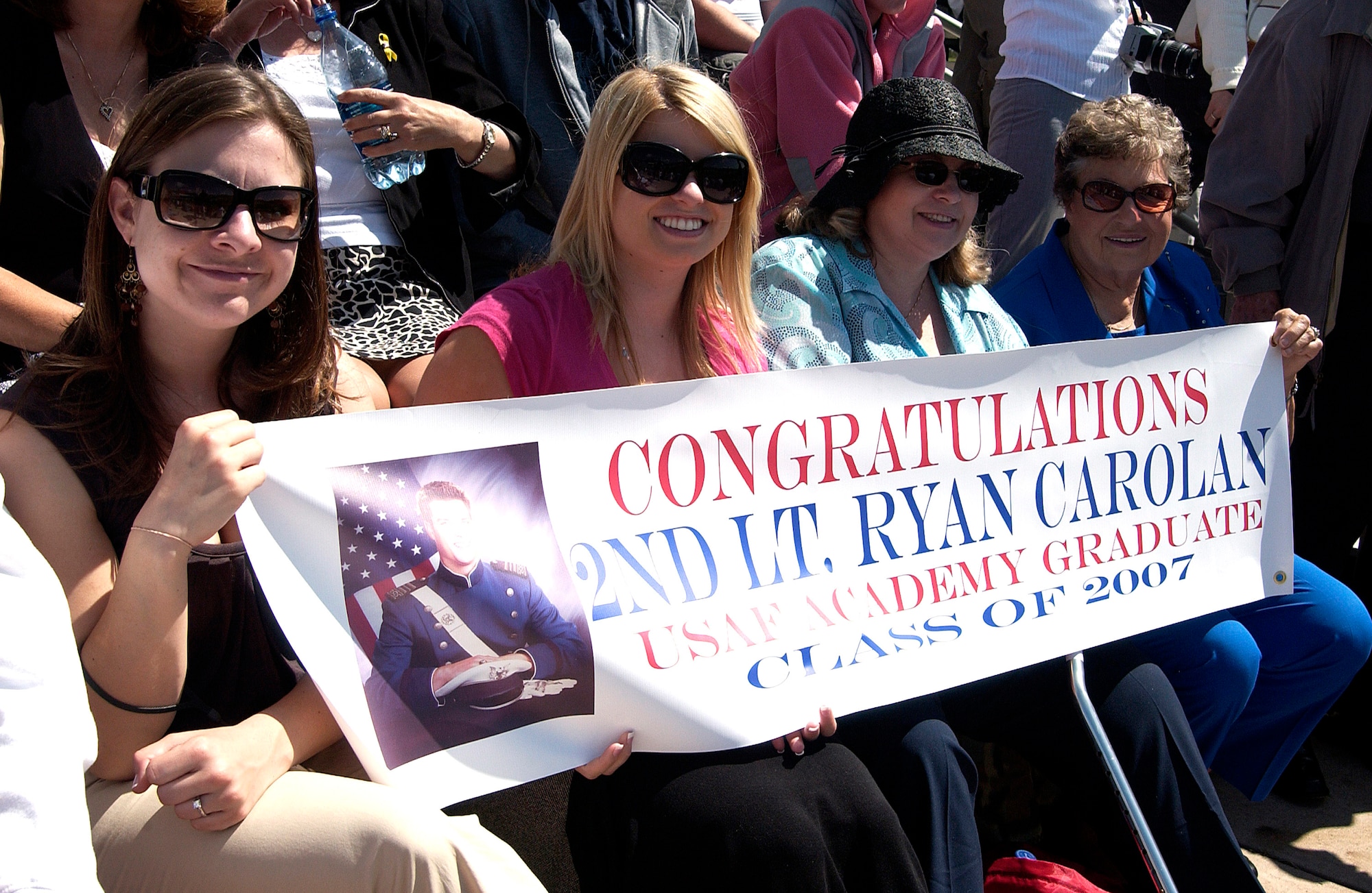 Family members of graduating cadet Ryan Carolan display a banner during the 2007 Graduation Parade May 29 at the U.S. Air Force Academy in Colorado. The graduation for the U.S. Air Force Academy's Class of 2007 will be held at 10 a.m. May 30 at Falcon Stadium. Secretary of Defense Dr. Robert M. Gates will be the guest speaker. Cadets are exposed to a balanced curriculum that provides a general and professional foundation essential to a career Air Force officer. (U.S. Air Force photo/Mike Kaplan) 
