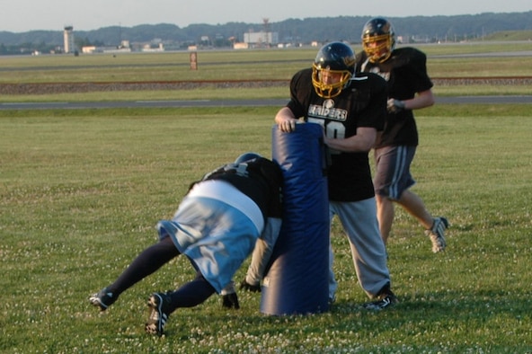 Yokota Warriors lineman Lateef Anderson, works on his lineman chopping with team mate Jeremy Jones during practice May 22 at Darling Field.