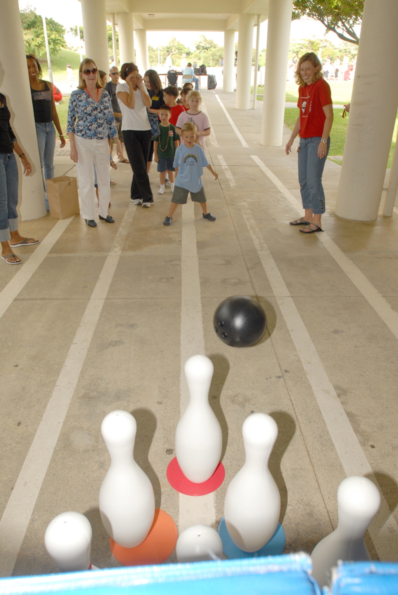 Bradley Wenham, son of Robin Wenham, throws an oversized bowling ball at some pins during one of the games at the Bob Hope Elementary School end of the year carnival May 24 at Kadena Air Base, Japan.
(U.S. Air Force/Airman 1st Class Kasey Zickmund)