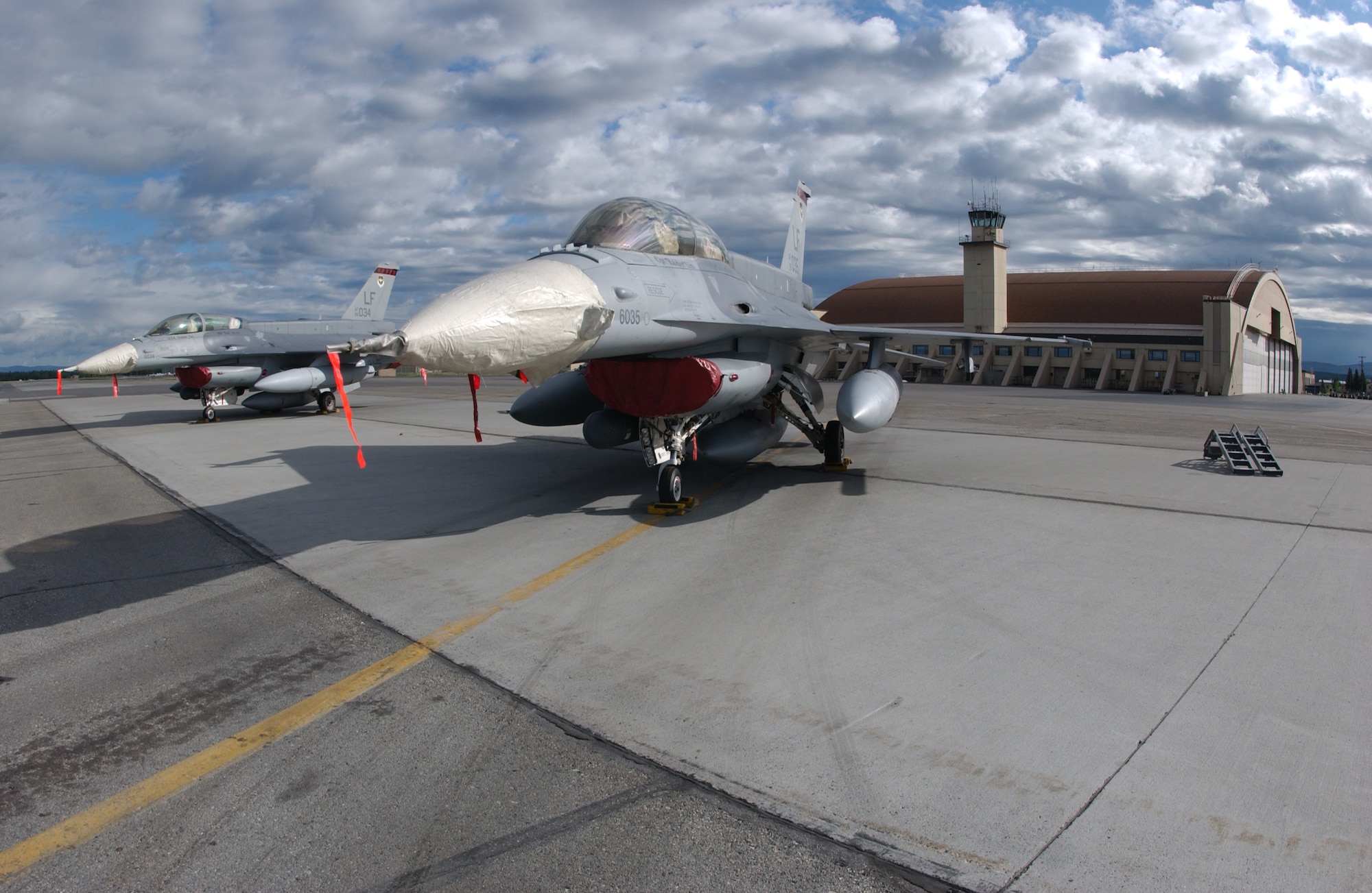 EIELSON AIR FORCE BASE, Alaska -- Two Republic of Singapore Air Force F-16 Fighting Falcons sit in front of the Thunderdome May 31 for Red Flag-Alaska 07-2. RF-A is a Pacific Air Forces-directed field training exercise for U.S. and coalition forces flown under simulated air-combat conditions. It is conducted on the Pacific Alaska Range Complex with air operations flown out of Eielson and Elmendorf Air Force Bases.  (U.S. Air Force Photo by Airman 1st Class Jonathan Snyder)