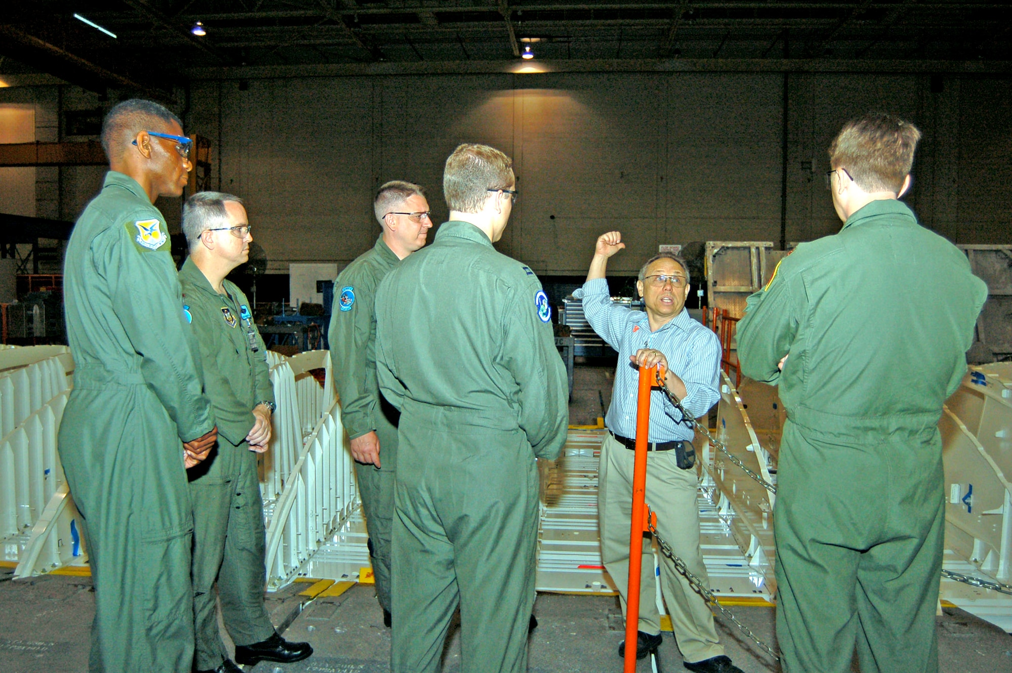 Boeing's Ken VanderHorst provides information about C-17 Globemaster III production to aircrew members from Dover Air Force Base, Del., during a tour of Boeing's Long Beach, Calif., facility May 30. The crew arrived in Long Beach May 29 and assumed ownership of Dover's first C-17 May 31. (U.S. Air Force photo/2nd Lt. Nicole Langley)