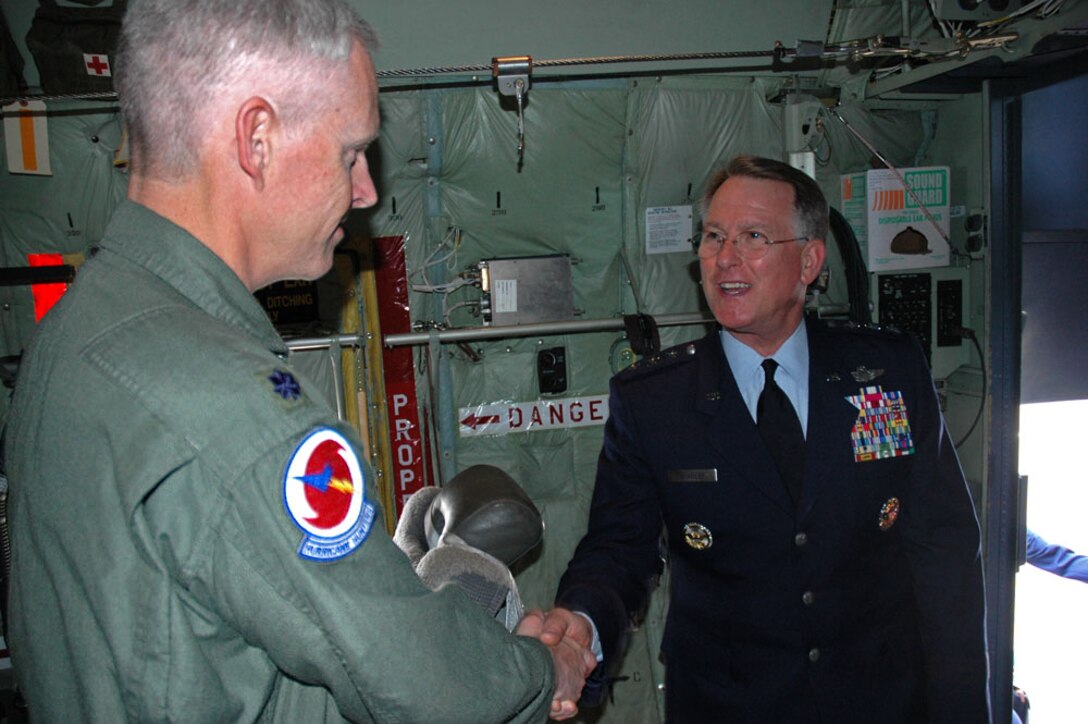 Lt. Gen. John A. Bradley, commander of the Air Force Reserve Command, exchanges greetings with Lt. Col. Jon Talbot, aerial reconnaissance weather officer for the "Hurricane Hunters". General Bradley recently toured the WC-130J as the Citizen Airmen of the 53rd Weather Reconnaissance Squadron prepare for beginning of hurricane season, which started June 1. 

The Air Force Reserve Hurricane Hunters are the only operational weather reconnaissance squadron in the world and have already flown Subtropical Storm Andrea in early May.

This season, the state-of-the-art WC-130J will be equipped with the Stepped-Frequency Microwave Radiometer, which continuously measures surface winds and rainfall rates occurring below the aircraft. The data collected by the Hurricane Hunters increase the accuracy of the National Hurricane Center Forecast up to 30 percent. (Air Force Photo/ Maj. Chad E. Gibson)