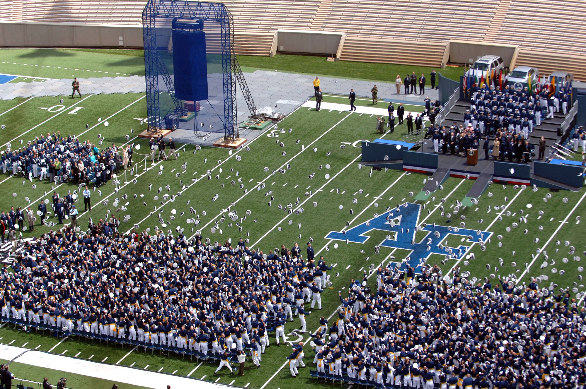 Hats are tossed as the U.S. Air Force Thunderbirds fly over the 2007 Air Force Academy Graduation Ceremony May 30 in Colorado. The ceremony marks the culmination of four years at the academy and their transition from cadet to the Air Force's newest second lieutenants. (U.S. Air Force photo/David Armer) 
