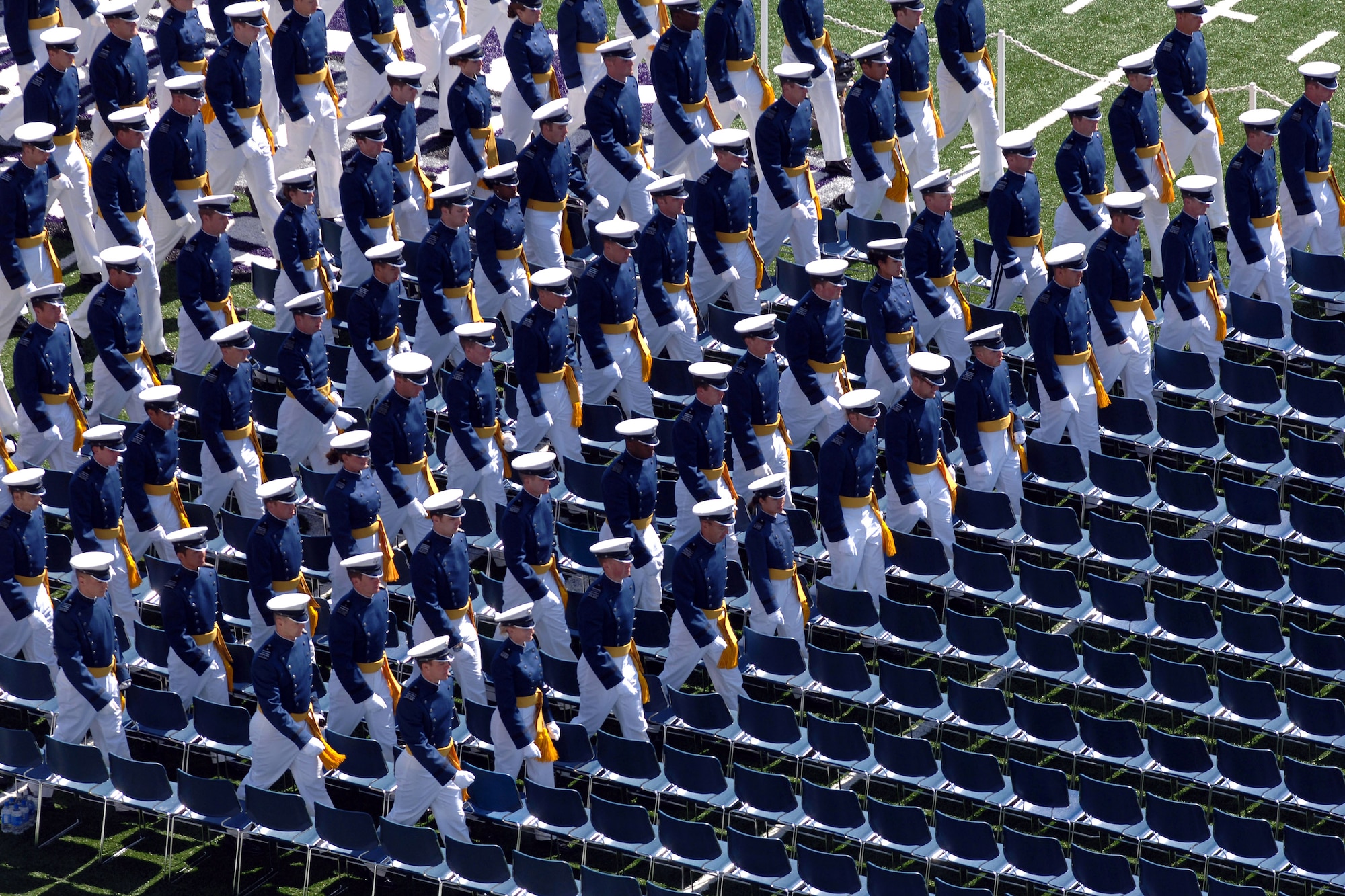 Members of the U.S. Air Force Academy Class of 2007 march onto the Falcon Stadium field to start the commencement ceremony May 30 in Colorado. The ceremony marks the culmination of four years at the academy and their transition from cadet to the Air Force's newest second lieutenants. (U.S. Air Force photo/David Armer)
