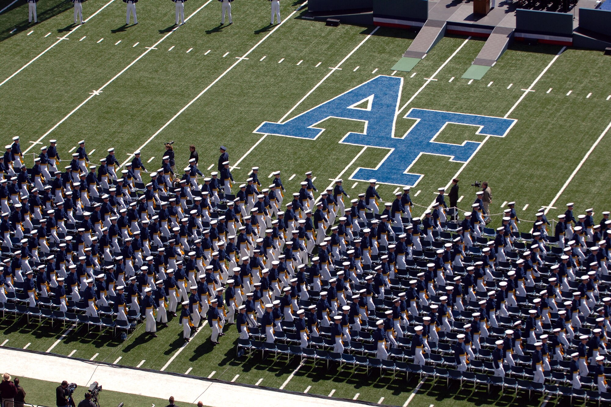 Members of the U.S. Air Force Academy Class of 2007 march onto the Falcon Stadium field to start the commencement ceremony May 30 in Colorado. The ceremony marks the culmination of four years at the academy and their transition from cadet to the Air Force's newest second lieutenants. (U.S. Air Force photo/David Armer)
