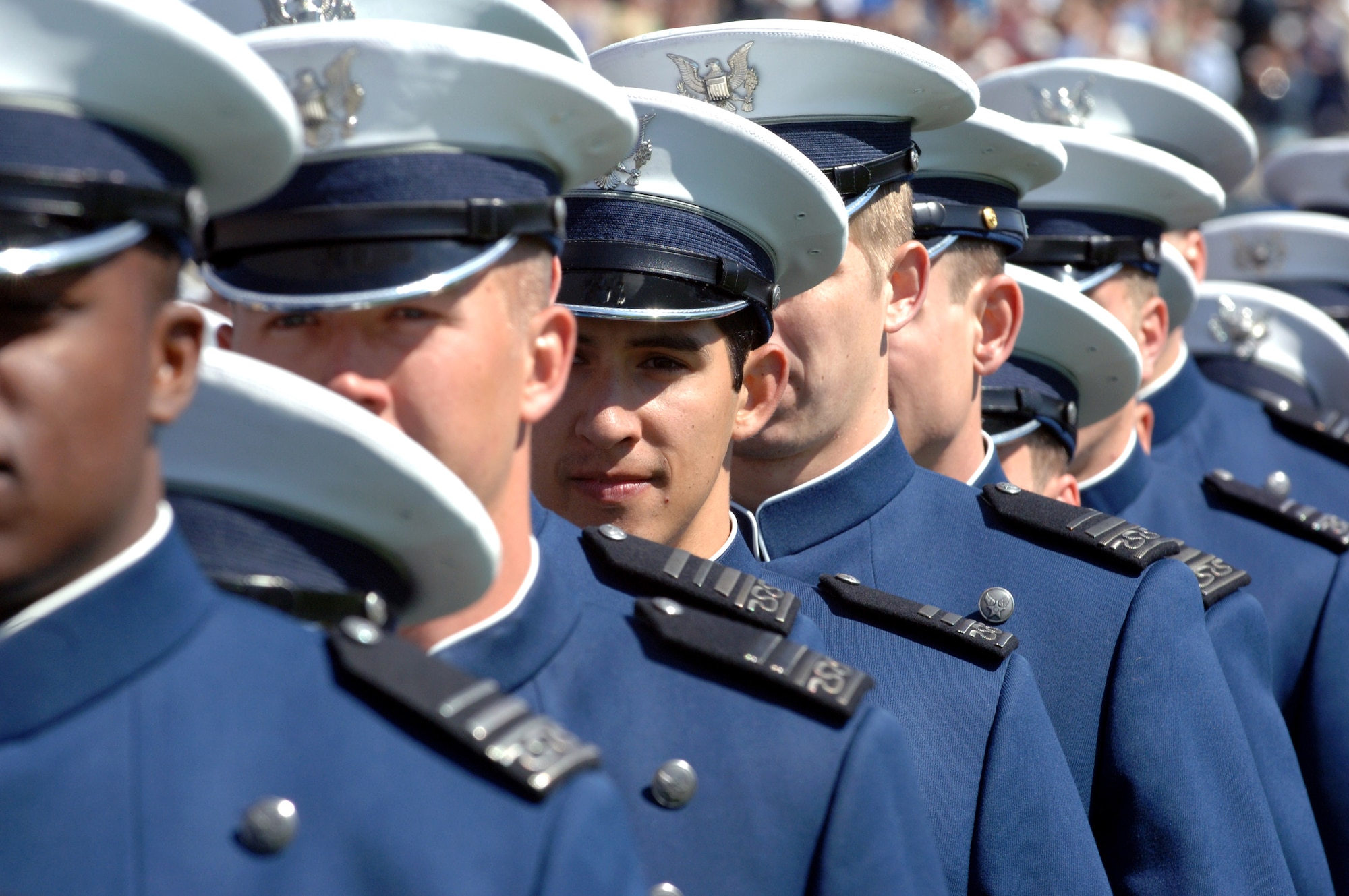 First class cadets from the U.S. Air Force Academy line up at the beginning of their commencement exercise to receive their degrees and assume the duties of the Air Force's newest second lieutenants May 30 in Colorado. The academy graduated 977 members of the class of 2007. (U.S. Air Force photo/Joel Strayer) 
