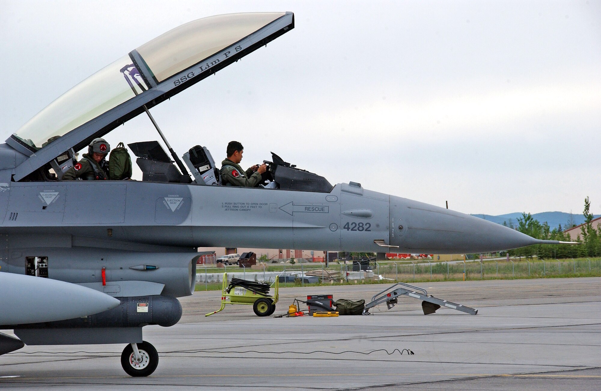 Republic of Singapore Air Force pilots from the 425th Fighter Squadron complete post-flight checks after landing at Eielson Air Force Base, Alaska, May 30 for Red Flag-Alaska 07-2. The 425th FS's mission is to provide advanced weapons and tactics continuation training for Republic of Singapore F-16 pilots and maintenance personnel. They are located at Luke Air Force Base, Ariz. (U.S. Air Force photo/Senior Airman Justin Weaver)
