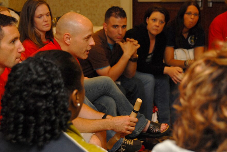 Master Sgt. Jon Wedel, U.S. Air Force Honor Guard, talks with other volunteer mentors at a mentor training session about his past experiences being involved in the Tragedy Assistance Program for Survivors. Held over Memorial Day weekend, TAPS is a three-day camp children and family members who have lost a loved one in military service can attend that aims to help teach families how to grieve, as well as share their stories and make friends who share their loss. (U.S. Air Force photo by Staff Sgt. Madelyn Waychoff)