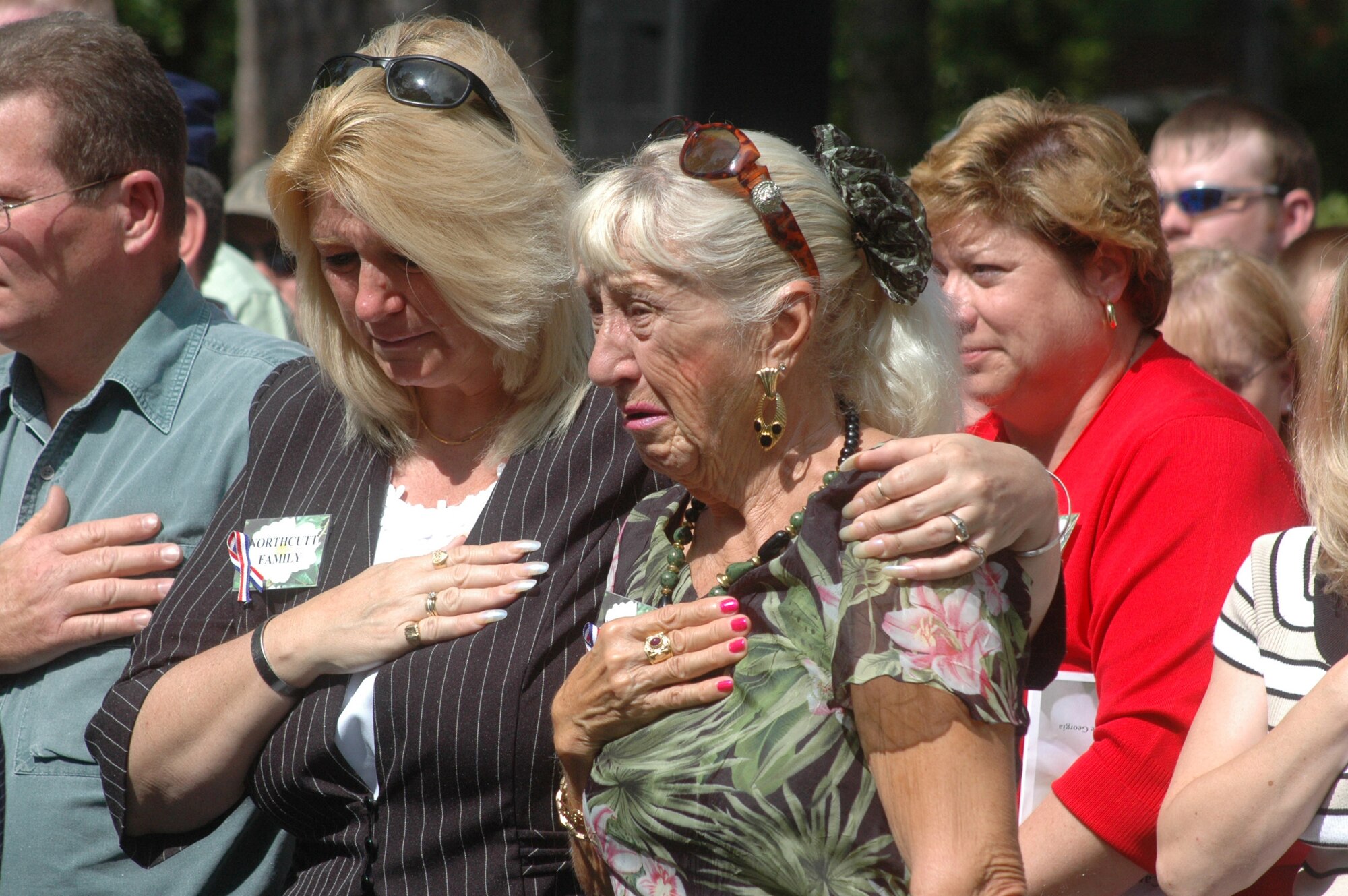 Margie Daniel and Anna Maria Northcutt, daughter and widow of Army SFC Clenord ( Bill) Northcutt, (Ret.) attend the Camellia Garden Memorial Ceremony. Family, friends and co-workers gathered May 24 to honor 67 men and women of Team Robins Plus who died in the past year. U. S. Air Force photo by Sue Sapp  