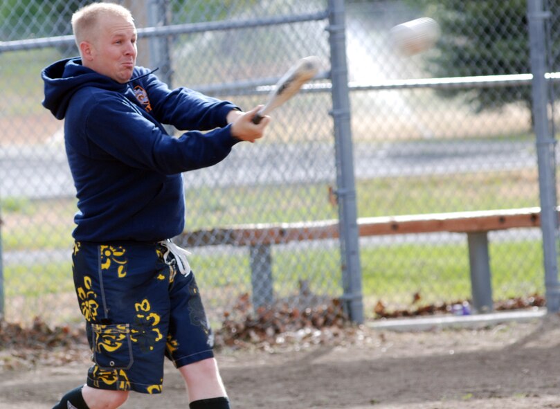 FAIRCHILD AIR FORCE BASE, Wash. -- Staff Sgt. Bobbie Busha, 92nd Security Forces Squadron military working dog handler, prepares to drive the ball into the outfield while practicing May 24. Members of the security forces softball team took batting practice to sharpen their skills prior to the start of the intramural softball season. (U.S. Air Force photo/Tech. Sgt. Larry Carpenter)