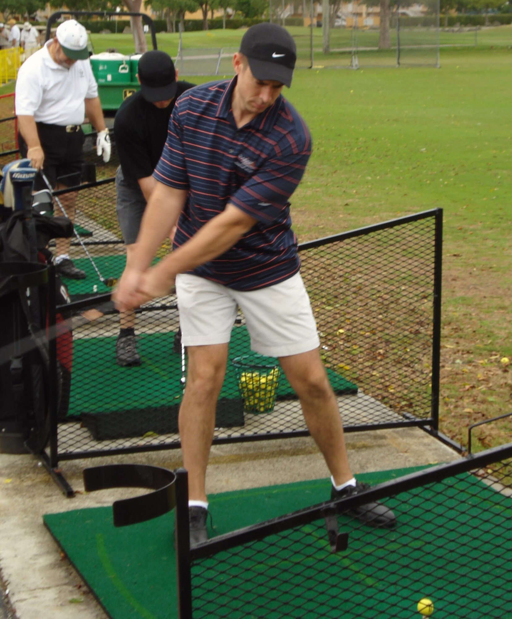 Major Sean “THOR” Carpenter, an F-16 pilot assigned to the 93rd Fighter Squadron at Homestead Air Reserve Base, warms up at the driving range before the shotgun start of the 16th annual Chamber South Military Affairs Committee golf tournament at the Miccosukee Golf and Country Club May 25.  THOR won the long drive contest during the tournament by hitting a 295-yard drive.  57 military golfers from the local area played for free in the tournament thanks to local civic and business leaders who sponsored them.  The tournament raised approximately $20,000 for the Chamber South chamber of commerce and culminated a month filled with military appreciation and awareness events.  (U.S. Air Force photo/Jake Shaw)