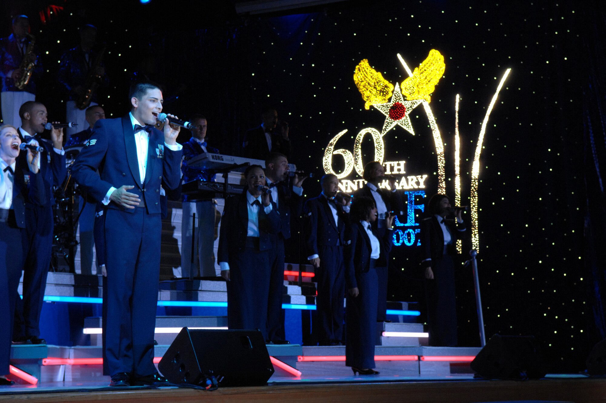 Tops in Blue Airmen sing to the crowd May 24 at the Tays Center near Holloman Air Force Base in Alamogordo, N.M. This year marks the 60th anniversary of the U.S. Air Force. Throughout the year, the Air Force is commemorating 60 years of air and space power. (U.S. Air Force photo/Senior Airman Anthony Nelson)