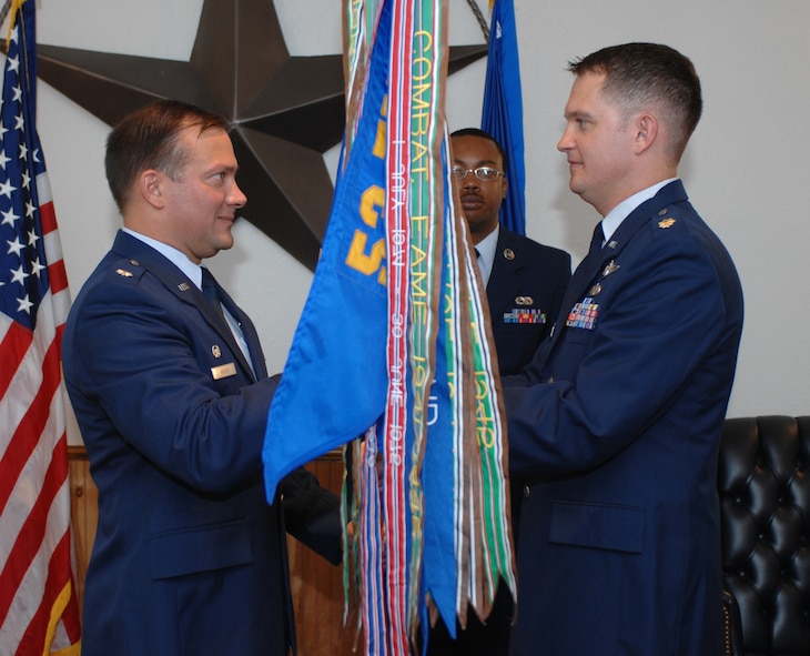 DYESS AIR FORCE BASE, Texas -- Major Stephen Burgh assumes command of the 29th Training Systems Squadron, Detachment 4, from Lt. Col. Jack Knight, 29th Test Management Group commander from Eglin AFB, Florida, at a change of command ceremony here May 30. (U.S. Air Force photo/Airman 1st Class Jennifer Romig)