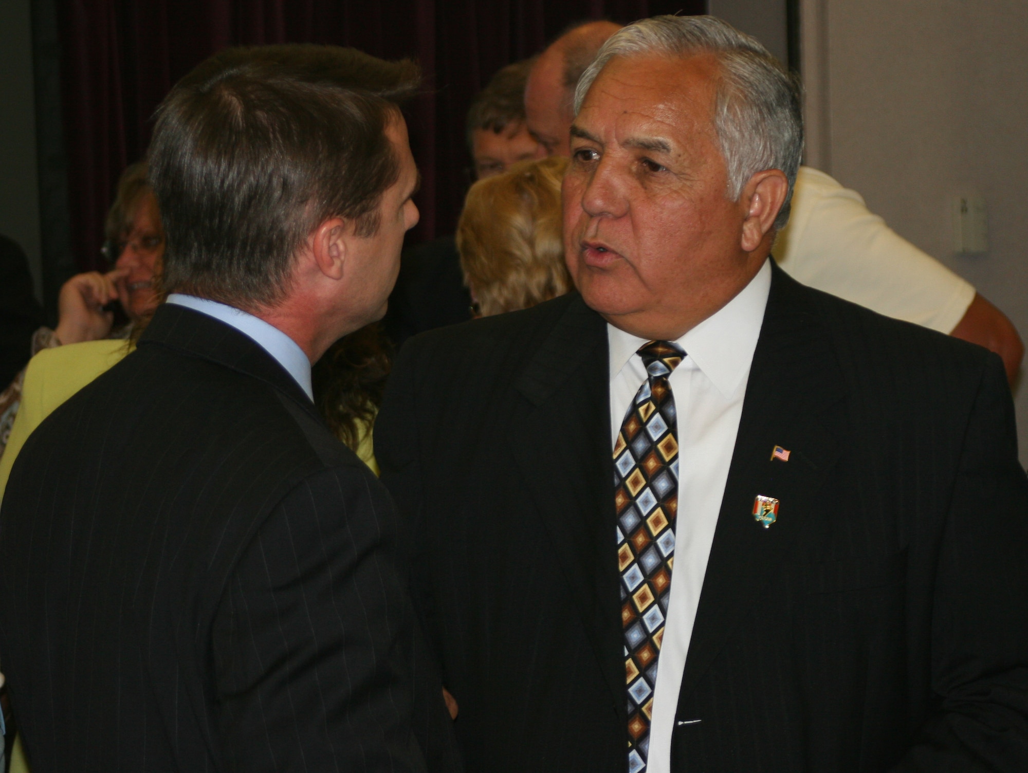 Congressman Silvestre Reyes, who represents the 16th District of Texas in the U.S. House of Representatives, talks to Todd Smith of Warrensburg, Mo., during a base community council luncheon at Mission’s End May 29. As a senior member of both the Armed Services and Select Intelligence Committees, Congressman Reyes is a key member of Congress on defense and military issues.  He attended the luncheon with Missouri Congressman Ike Skelton, and U.S. Navy Rear Admiral Mark Ferguson, Navy legislative affairs chief. Congressman Reyes, who served in the U.S. Army and is a Vietnam War veteran, thanked Whiteman members for their service and patriotism.(U.S. Air Force photo/Staff Sgt. Rob Hazelett)