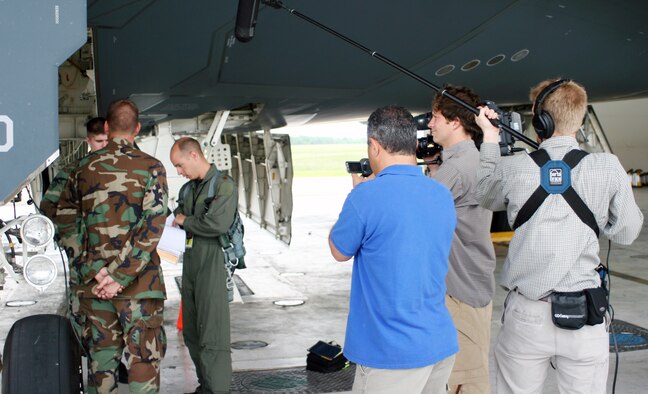 Maj. Matt Calhoun, 13th Bomb Squadron, performs a pre-flight inspection of a B-2 while a Smithsonian Institute film crew documents his briefing with crew chiefs May 24 for a feature documentary on stealth technology. The documentary is scheduled to air in the fall. (U.S. Air Force photo/Tech. Sgt. Matt Summers)