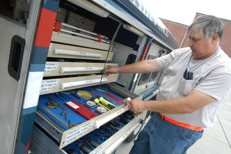 Allan Widener has anything he needs for a repair at his fingertips inside the War Wagon in May at Robins Air Force Base, Ga. The 37-foot long, tractor-trailer based at the 402nd Commodities Maintenance Group deploys around the world with a traveling repairman in support of the warfighter anywhere at a moment's notice. Mr. Widener is a driver and mechanic from Robins AFB. (U.S. Air Force photo/Sue Sapp) 
