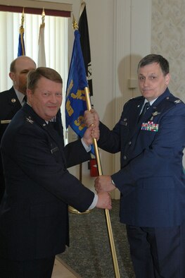 YOUNGSTOWN AIR RESERVE STATION - Col. Ronnie J. Roberts accepts the guidon of the 910th Medical Squadron from Col. Tim Thomson, 910th Airflift Wing commander, during a change of command ceremony for the medical squadron held at the base club here May 6. Col. Roberts, a Youngstown-Warren area native accepted the hometown assignment after spending more than two years as the commander of the 908th Aeromedical Evacuation Squadron, based at Maxwell Air Force Base, Alabama. U.S. Air Force photo/Tech. Sgt. Bob Barko Jr.