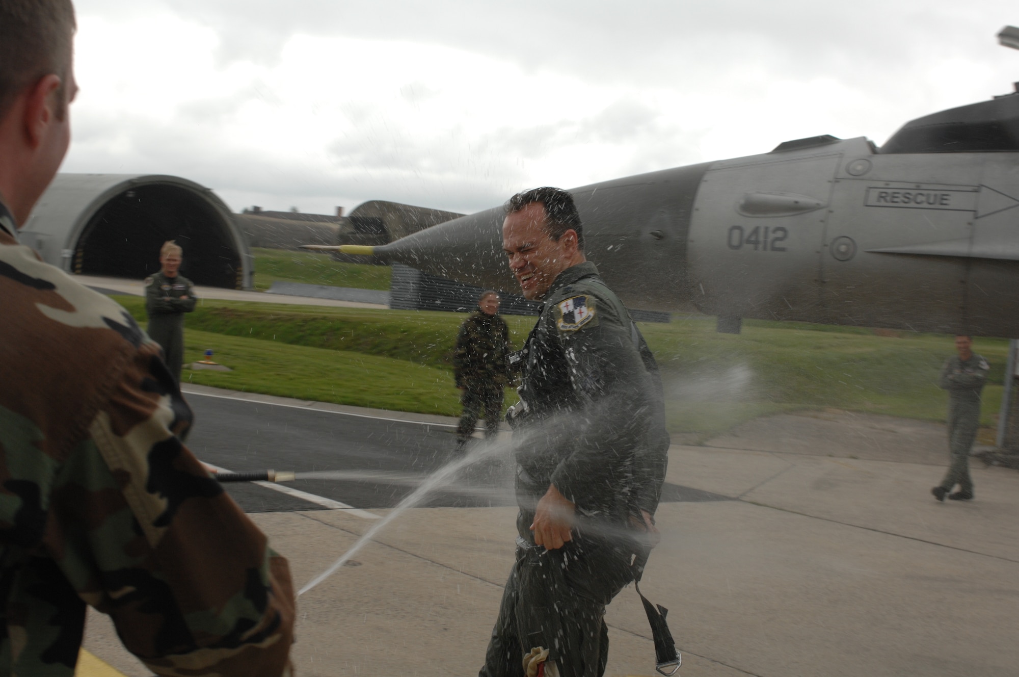 SPANGDAHLEM AIR BASE, GERMANY -- Family, friends and fellow Airmen help Lt. Col. Steve Bowen, 52nd Operations Support Squadron commander, celebrate his 3,000 hours of flying in the F-16 May 29. Colonel Bowen, who was born in Munich, Germany, took over command of the squadron in June 2005. He’s been named a distinguished graduate three times in his career, and plans to fly as long as the Air Force will let him. Colonel Bowen is married with two children. (US Air Force photo/Airman 1st Class Stephanie Clark) 