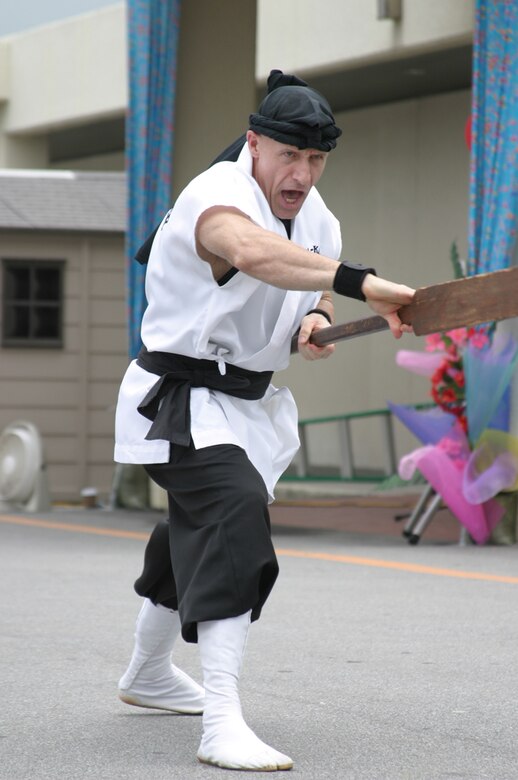 Ron Nix, founder of the Ron Nix Hamaya Daiko group, performs a martial arts demonstration during the Asian Pacific Heritage Month celebration May 26 at the Kadena Air Base, Japan, exchange parking lot. Seven groups performed cultural dances and martial arts demonstrations including: Renshinkan Karate Dojo, Venoltian Relic, Magahet Pacific Dance group, a live Hawaiian band and the Philippine Cultural Dancers group.
(U.S. Air Force/Senior Airman Nestor Cruz)