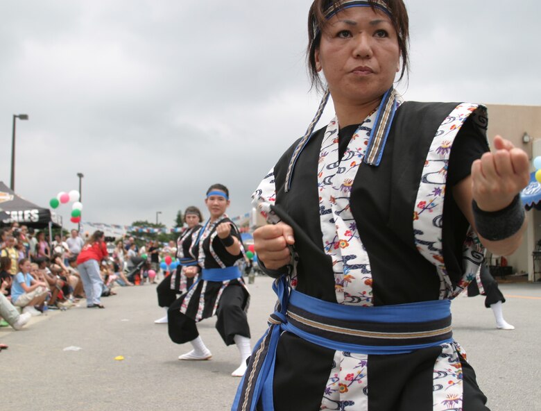 Members from the Ron Nix Hamaya Daiko group perform a martial arts demonstration during the Asian Pacific Heritage Month celebration May 26 at the Kadena Air Base, Japan, exchange parking lot. Seven groups performed cultural dances and martial arts demonstrations including: Renshinkan Karate Dojo, Venoltian Relic, Magahet Pacific Dance group, a live Hawaiian band and the Philippine Cultural Dancers group.
(U.S. Air Force/Senior Airman Nestor Cruz)