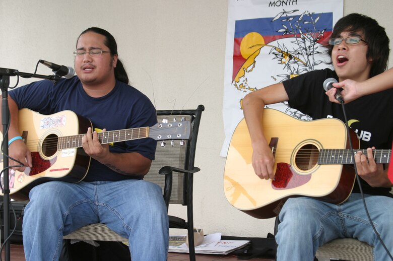 Brandon Diaz (left) and Brandon Persson of Venoltian Relic sing during the Asian Pacific Heritage Month celebration May 26 at the Kadena Air Base, Japan, exchange parking lot. Seven groups performed cultural dances and martial arts demonstrations including: Renshinkan Karate Dojo, the Philippine Cultural Dancers group, Magahet Pacific Dance group, a live Hawaiian band and the Ron Nix Hamaya Daiko group.
(U.S. Air Force/Senior Airman Nestor Cruz)