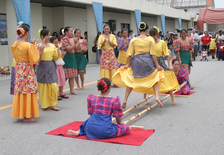 Members from the Philippine Cultural Dancers group perform a traditional dance number during the Asian Pacific Heritage Month celebration May 26 at the Kadena Air Base, Japan, exchange parking lot. Seven groups performed cultural dances and martial arts demonstrations including: Renshinkan Karate Dojo, Venoltian Relic, Magahet Pacific Dance group, a live Hawaiian band and the Ron Nix Hamaya Daiko group.
(U.S. Air Force/Senior Airman Nestor Cruz)