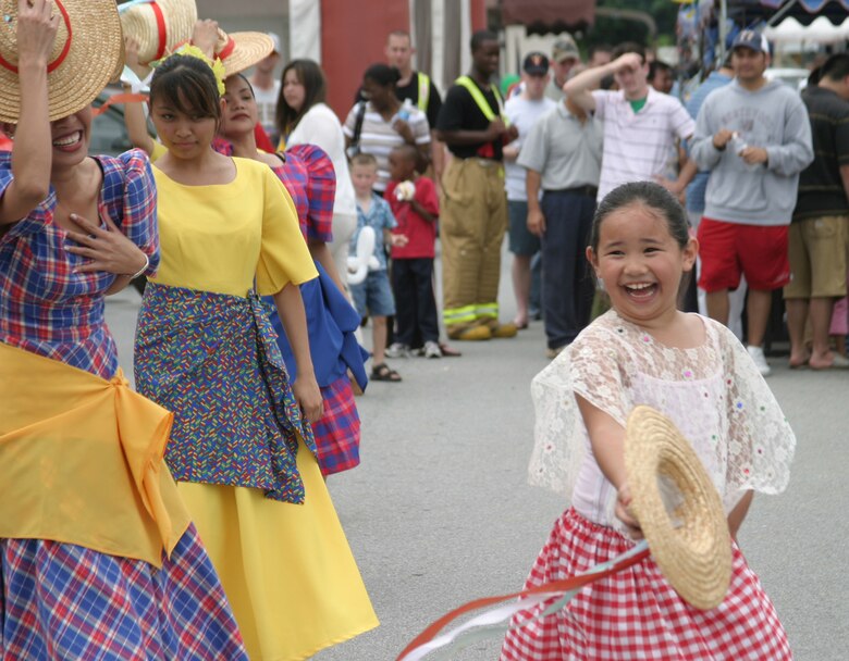 Members of the Philippine Cultural Dancers group perform a traditional dance number during the Asian Pacific Heritage Month celebration May 26 at the Kadena Air Base, Japan, exchange parking lot. Seven groups performed cultural dances and martial arts demonstrations including: Renshinkan Karate Dojo, Venoltian Relic, Magahet Pacific Dance group, a live Hawaiian band and the Ron Nix Hamaya Daiko group.
(U.S. Air Force/Senior Airman Nestor Cruz)