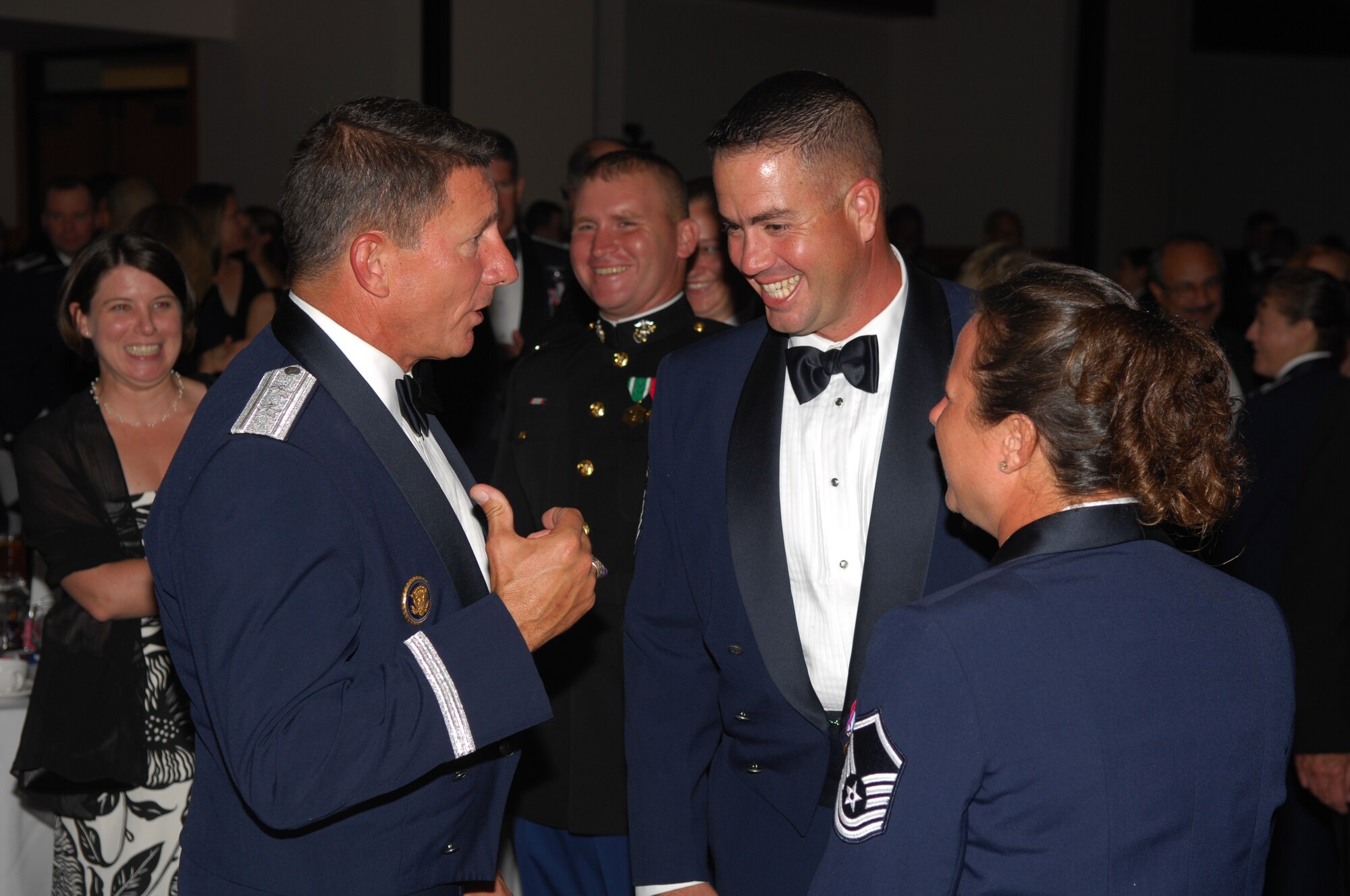 Maj. Gen. Michael Gould (left), 2nd Air Force commander, takes a few moments to talk with Master Sgt. Thomas Desantis of the 315th Training Squadron (center) and Master Sgt. Annette Whitenack (right) during the 2007 Air Force Ball Sept. 29. (U.S. Air Force photo by Staff Sgt. John Barton)