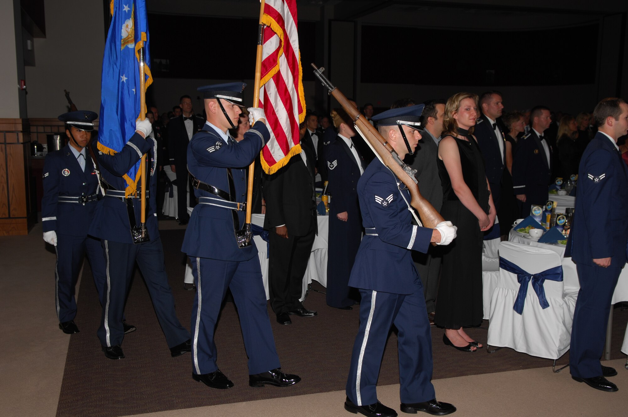 Guest at this year’s Goodfellow Air Force Ball Sept. 29. rise to their and feet and remain silent as members from the Goodfellow Air Force Base Honor Guard march their way through the C.J. Davidson Center in order to present the colors. (U.S. Air Force photo by Staff Sgt. John Barton)