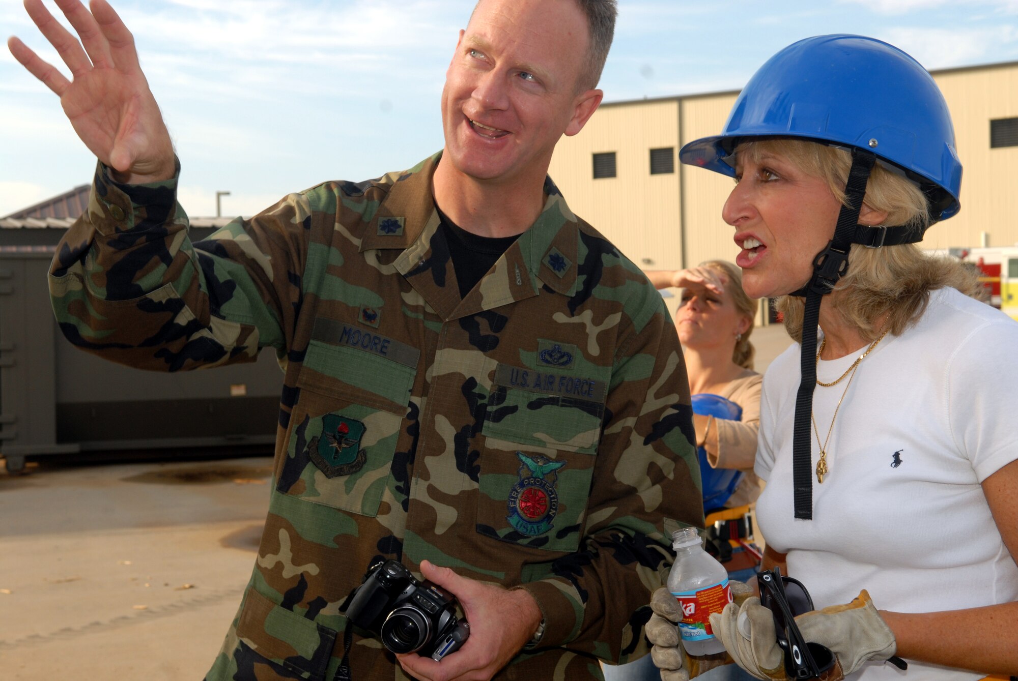 Lt. Col. Shawn Moore, 312th Training Squadron commander, explains rappelling procedures to Mrs. Paula Gould, wife of Maj. Gen. Michael Gould, 2nd Air Force commander. Gen. Gould and his were given a tour of the Louis F. Garland Department of Defense Fire Academy Sept. 28. (U.S. Air Force photo by Airman 1st Class Kamaile Chan)