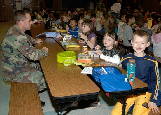 MCCONNELL AIR FORCE BASE, Kan. -- Staff Sergeant Matt Walters 22nd Aircraft Maintenance Squadron spends time with 2nd graders at Wineteer Elementary School for the Lunch Buddies program Oct. 25.  The Lunch Buddies program pairs a caring adult with an elementary student that needs a positive role model, McConnell Air Force Base personnel volunteer to participate in this program once a week.  (Photo by Airman 1st Class Justin Shelton)