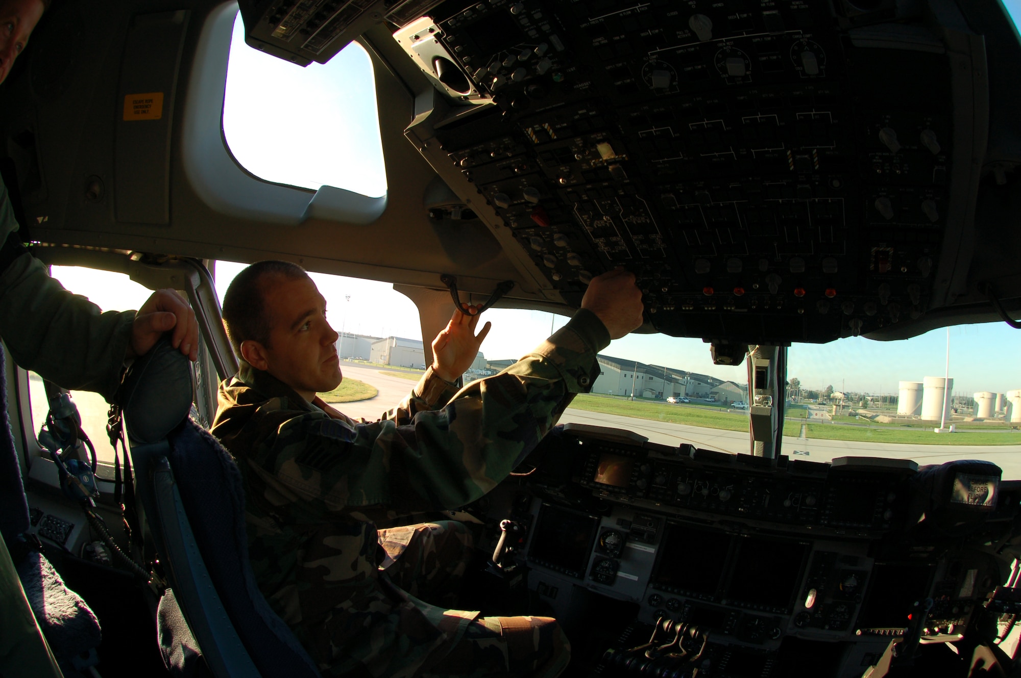 Airman 1st Class Alexander Keel, 736th Aircraft Maintenance Squadron crew chief and Orlando, Fla., native, connects a grounding wire before performing maintenance on a C-17 Globemaster III Wednesday. (U.S. Air Force photo/Senior Airman James Bolinger)
