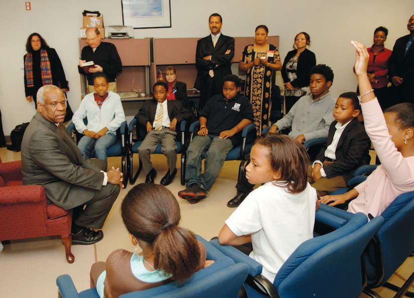 Students ranging from six to 15 years old from the Henson Valley Montessori School received a chance to sit and ask questions of Supreme Court Justice Clarence Thomas, prior to a book signing at the Base Exhcnage on Oct. 27. (US Air Force/Senior Airman Jeff Andrejcik)