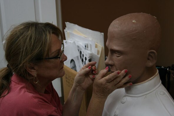Sculptor Elaine Bell sculpts the face of local, fallen hero Private Nathan Clemons at MARBLECast Inc. in Salt Lake City.(Photo courtesy of Operation Never Forget)