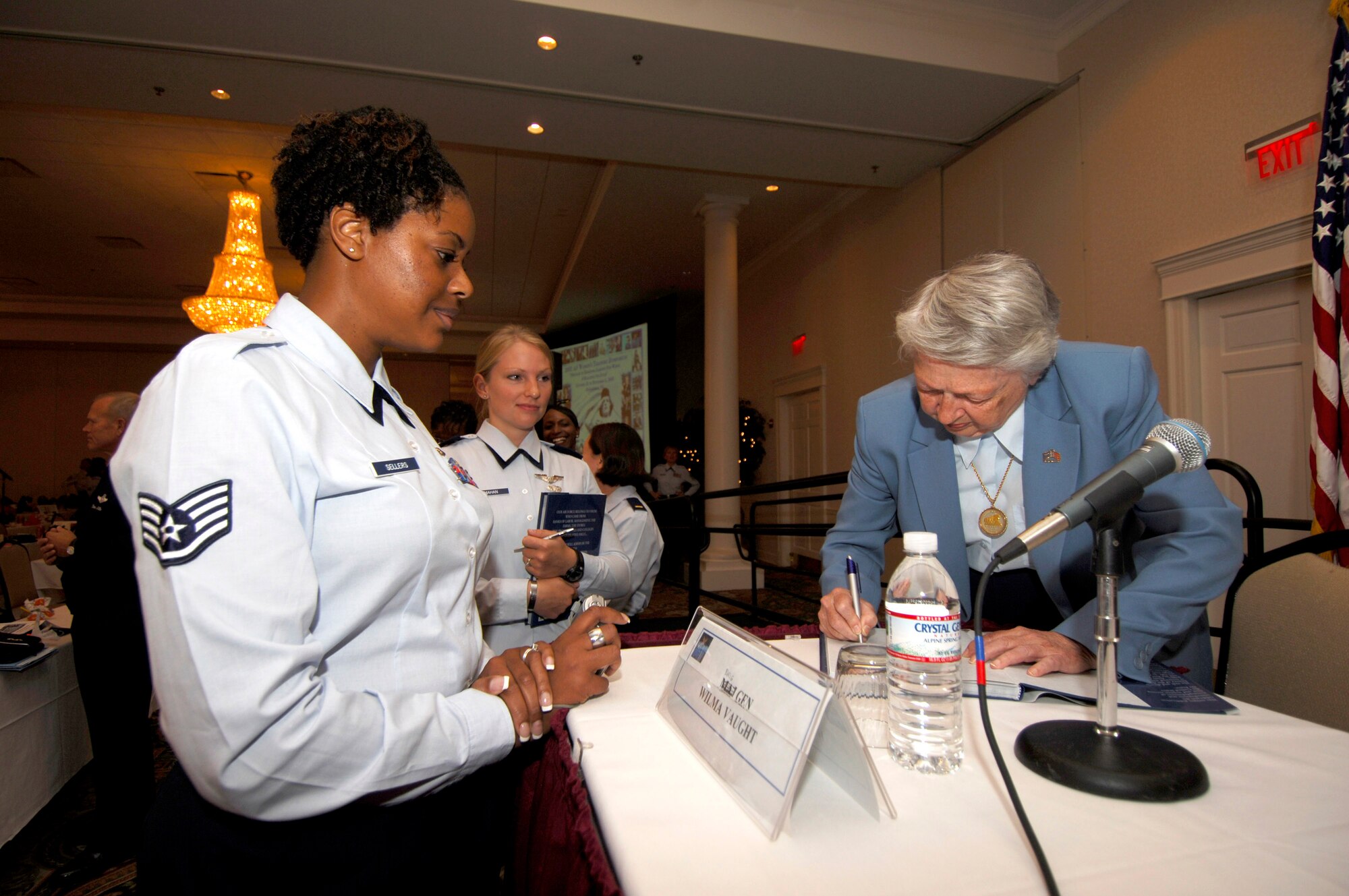 Brig. Gen. Wilma Vaught, signs a book for  Staff Sgt. Nina Sellers at the 2007 Air Force Heritage to Horizon Women's Training Symposium in Springfield, Va., Oct. 31. (U.S. Air Force photo/Staff Sgt. Suzanne M. Day)