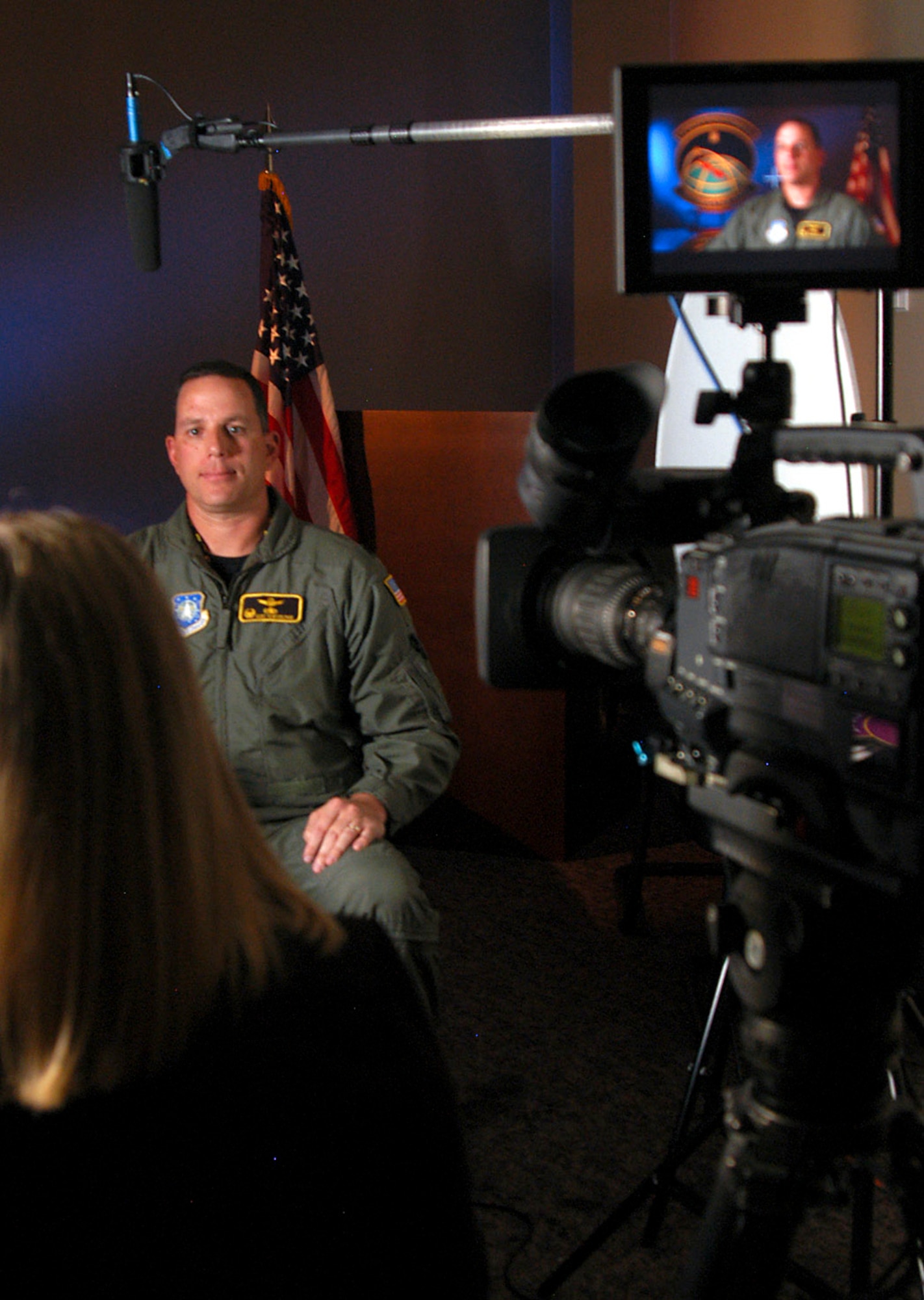 Lt. Col. Kurt Kuntzelman discusses GPS with Kaylan Eggert of Actuality Productions for a segment on the History Channel's "Modern Marvels" TV show Oct. 30. The segment will be part of an episode featuring technology that also includes the World Wide Web, DVD and digital video recorders. The episode is scheduled to air Feb. 14, 2008. Colonel Kuntzelman is commander of the 2nd Space Operations Squadron here. (U.S. Air Force photo/Staff Sgt. Don Branum) 