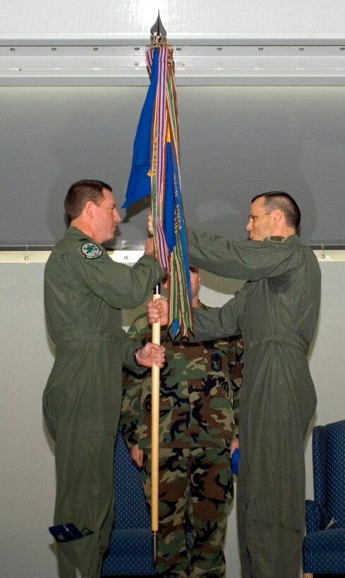 Col. James Hecker presents the 525th Tactical Fighter Squadron flag to Lt. Col. Chuck Corcoran. Colonel Corcoran assumed command of the 525th Fighter Squadron during an activation ceremony Oct. 29 at Elmendorf Air Force Base, Alaska. Colonel Hecker is the 3rd Operations Group commander. The squadron was inactivated as the 525th TFS in 1992. (U.S. Air Force photo/Airman 1st Class Tinese Treadwell)