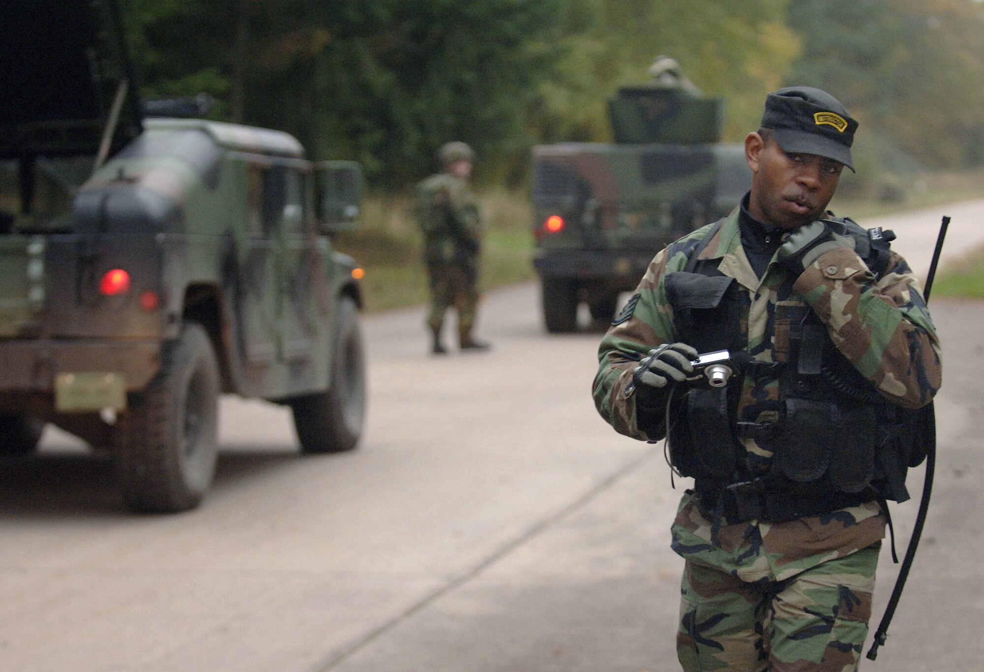 Staff Sgt. Avonte Seabrooks coordinates details of a convoy patrol scenario while using a digital camera to record observations Oct. 26 on the final day of a two-week pre-deployment course known as Creek Defender on Baumholder U.S. Army Garrison in southern Germany. The observations will be compiled into detailed reports that are sent back to unit commanders highlighting the strengths and weaknesses of each deploying security forces team. Sergeant Seabrooks is an instructor and one of 22 people assigned to the 786th Security Forces Squadron's regional training center at Sembach Air Base, Germany. (U.S.  Air Force photo/Master Sgt. Scott Wagers)
